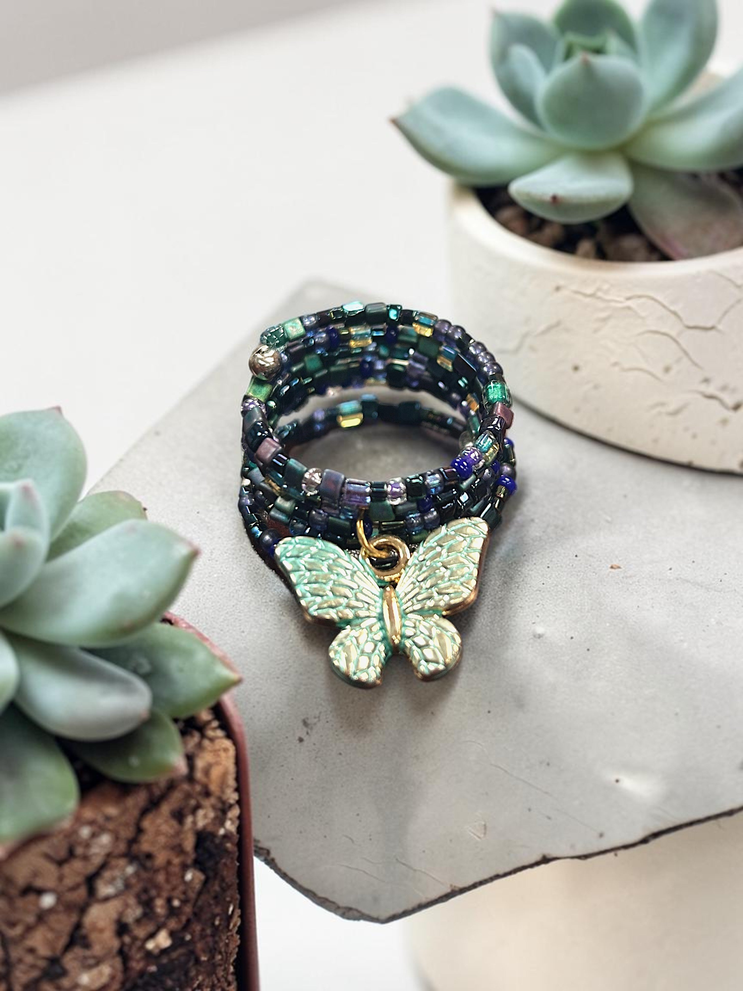 Iridescent Deep Multicolored Beaded Spiral Ring with Aqua Butterfly Charm | Unique Handmade Jewelry